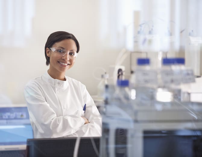 Scientist wearing protective glasses in lab