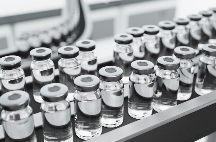 Non-endotoxin pyrogen risk assessment required for production. For example like these vaccine vials on a production line in a pharmaceutical factory.