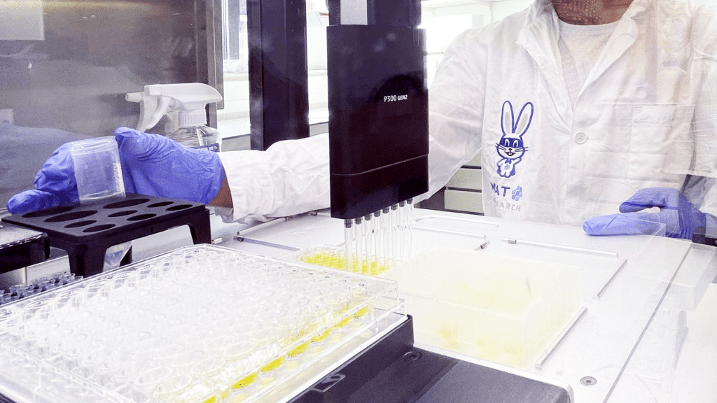 Scientist operating the AutoMATr. A MAT automation robot by MAT Research.